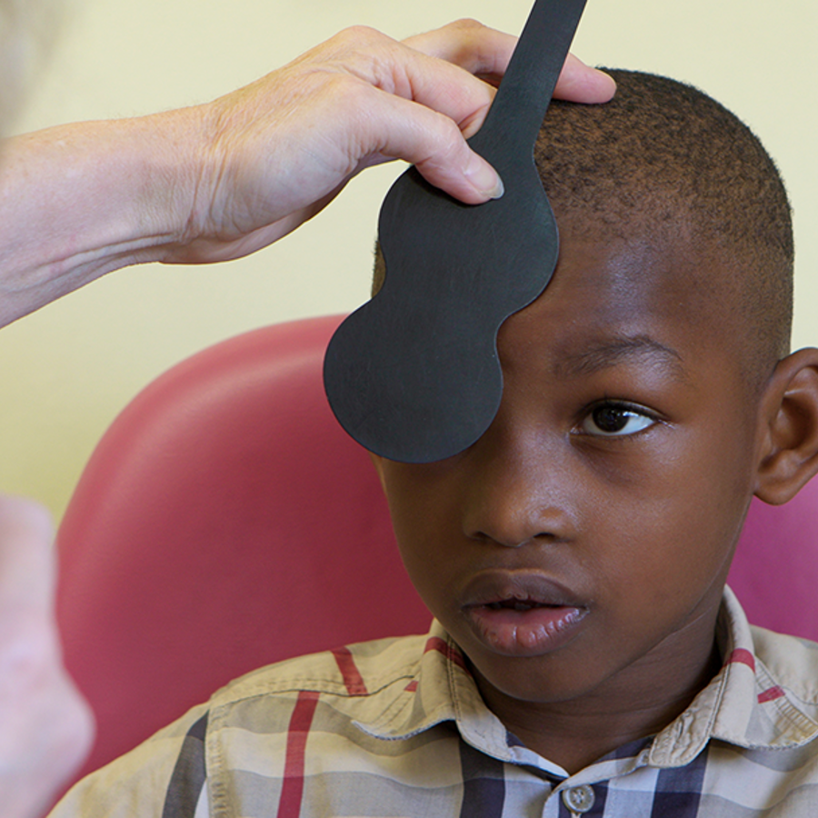 Boy During Eye Appointment Checking Using Blocker