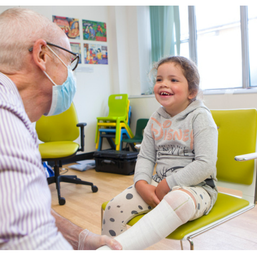 Photo of child getting a plaster cast