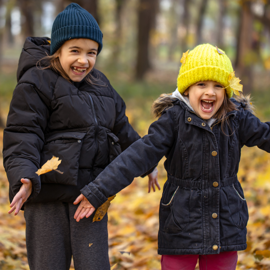 Two Funny Little Girls Bright Hats Walk Autumn Forest Blurred Background (1)