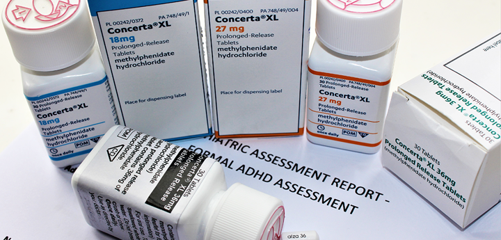 ADHD medication (Concerta) boxes and pill containers.