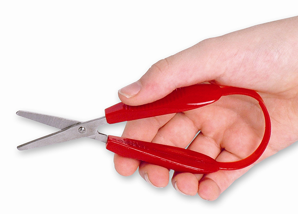 child holding easigrip scissors